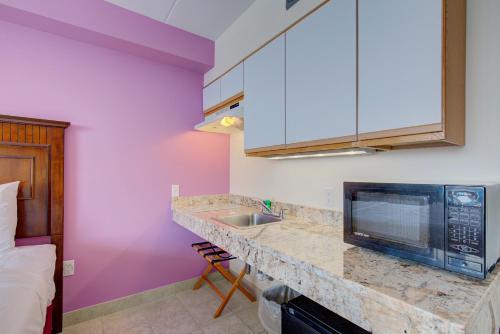 a kitchen with a sink and a microwave at Ocean 7 in Ocean City