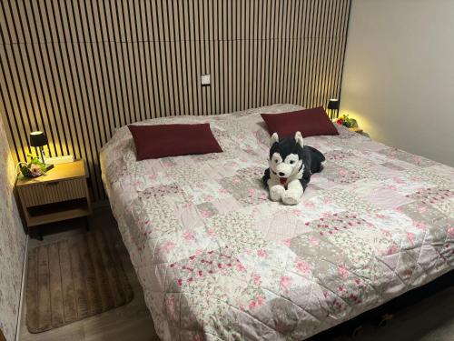 a stuffed animal sitting on top of a bed at Ferienwohnung Waldblick in Winterberg