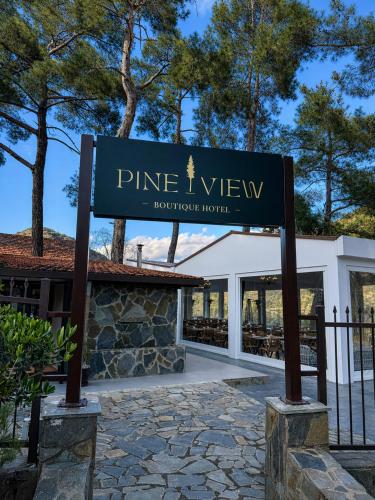 a sign for the entrance to pine view resort at Pine View Boutique Hotel Adults Only in Troodos