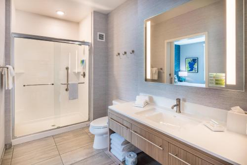 a bathroom with a sink and a shower and a toilet at Home2 Suites By Hilton Temecula in Temecula