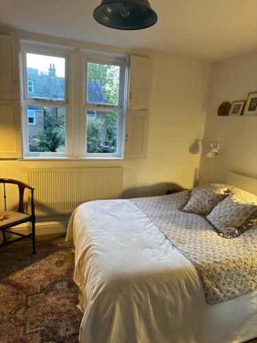 a bedroom with a bed and a window at 64 Cressingham Road in London