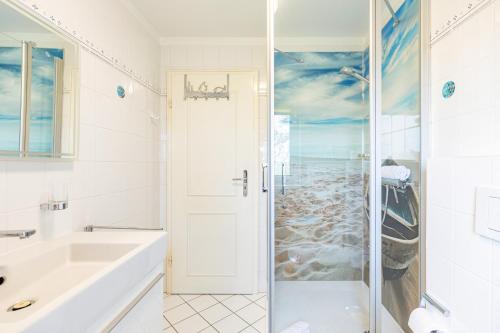 a bathroom with a shower and a sink at Westmarkenpalais in Böhl