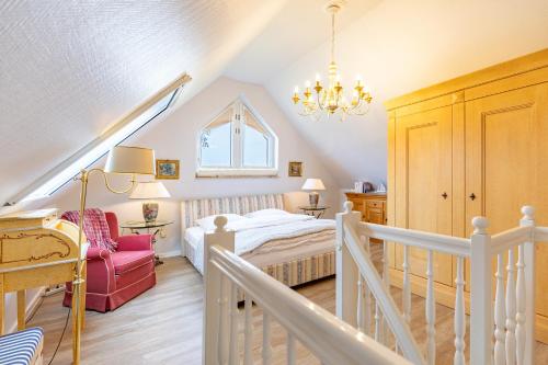 a small bedroom with a bed and a staircase at Westmarkenpalais in Böhl