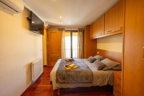 a bedroom with a bed with a tray on it at Casa L'Escala 31 in L'Escala