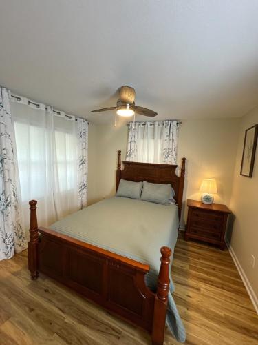 a bedroom with a bed and a ceiling fan at Serenity Cove in Hiawassee
