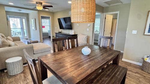 a living room with a wooden table and a couch at The Sands in New Buffalo