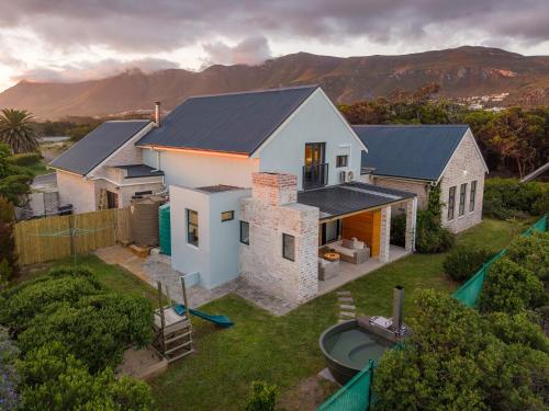 an aerial view of a house with a backyard at Modern Coastal Retreat - Private Hot Tub & Sauna in Hermanus