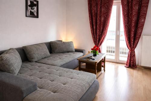 a living room with a couch and a table at Holiday Rhein 3 in Boppard