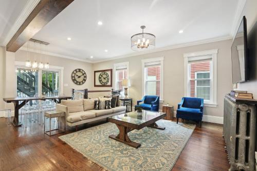 a living room with a couch and a table at Boston Escape Near T in Boston