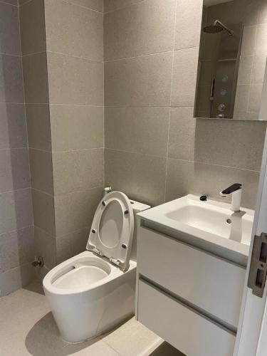 a bathroom with a toilet and a sink at Tanji Cliffs in Tanji