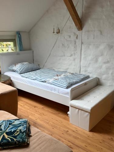 a bedroom with a large bed with avisor at Ferienwohnung Siegglück in Mittelhof