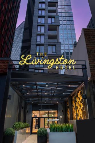 a sign for the entrance to a hotel at The Livingston, part of JdV by Hyatt in Brooklyn