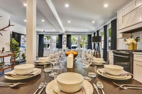 a dining room with a table with glasses on it at Luxe Boston Condo Near T in Boston