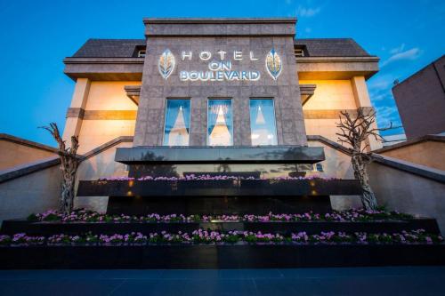 a building with a sign that reads hotel on soundland at Hotel on Boulevard in Johannesburg