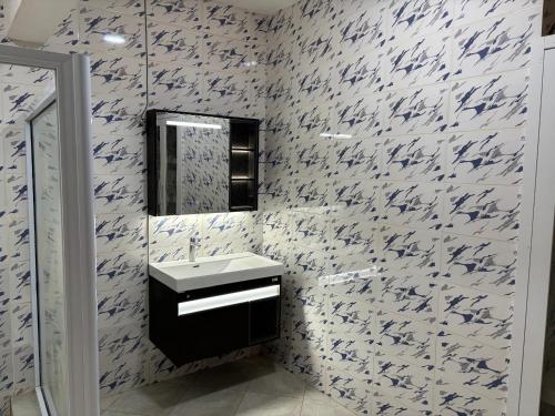 a bathroom with a sink and a mirror at Grand View Lodge in Trofwi