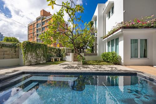 a swimming pool in the backyard of a house at Casa Piccioni by Otium in San Juan