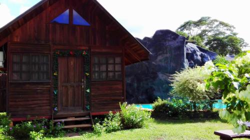 a house with a christmasreath on the door at Hotel Cabanas La Teca in Liberia