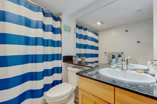 a bathroom with a sink and a toilet and a shower at My Place at Pike Place in Seattle