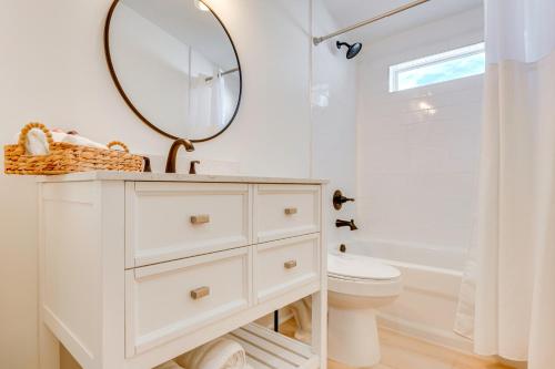 a white bathroom with a sink and a mirror at Brand New Home in Steinhatchee with Rooftop Deck! in Jena