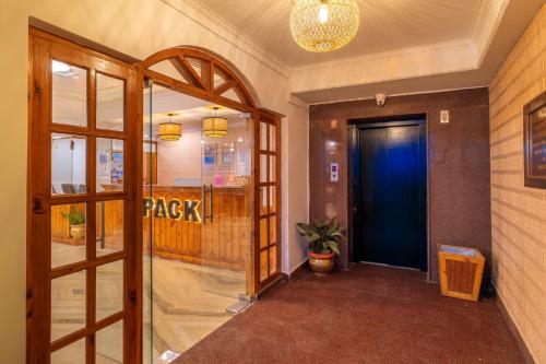 a hallway with a door leading to a walk way at PACK Shimla in Shimla