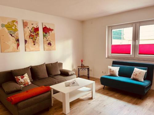 a living room with a couch and a table at Ferienwohnung Moselverliebt in Schweich