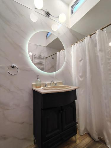 a bathroom with a sink and a mirror at CM Descanso boutique in Colorado River