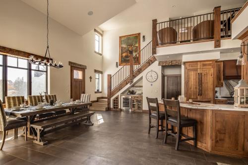 a dining room with a long table and chairs at Creekside Chalet in Big Sky