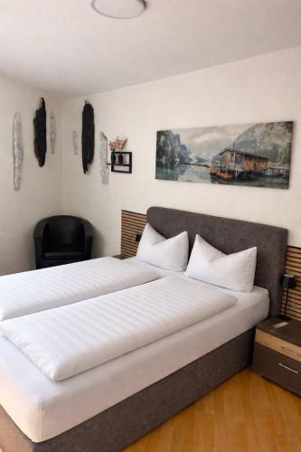 a bedroom with a large bed with white sheets at Smartes Panorama City Apartment - Top Location! in Halle an der Saale