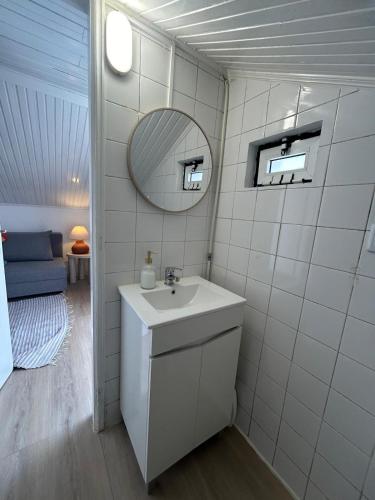 a bathroom with a sink and a mirror at Vila Real Center Terrace in Vila Real