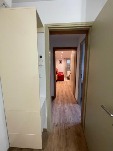 a hallway leading into a living room with a hallway at chambresdusoleil in Hoffen