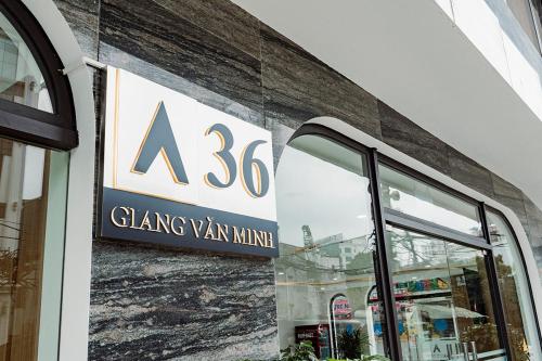 a sign on the side of a building with a glass vaan minuilding at A25 Premium Hotel - 36 Giang Văn Minh in Hanoi