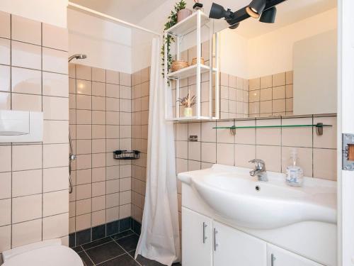 a bathroom with a sink and a shower at 7 person holiday home in Ringkøbing in Ringkøbing