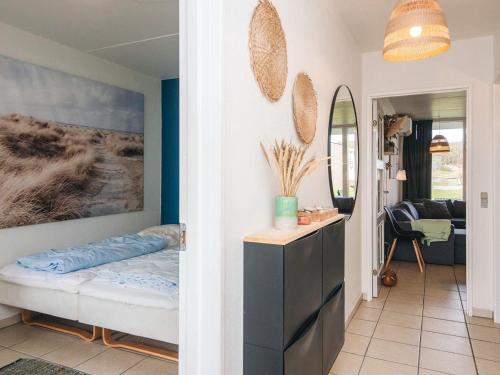 a hallway with a bedroom and a living room at 7 person holiday home in Ringkøbing in Ringkøbing