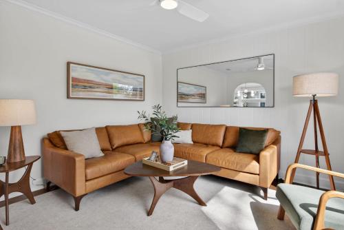 a living room with a couch and a table at 10th St Retreat in Boise