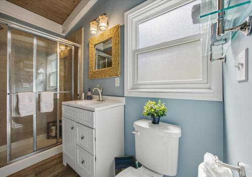 a bathroom with a toilet and a sink and a shower at Bruno's Landing in Kansas City