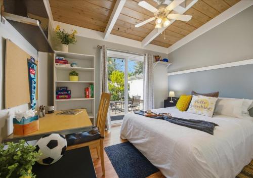 a bedroom with a bed and a desk with a soccer ball on it at Bruno's Landing in Kansas City