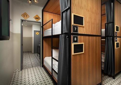 a room with two bunk beds and a doorway at Hostal CASA MX centro in Mexico City