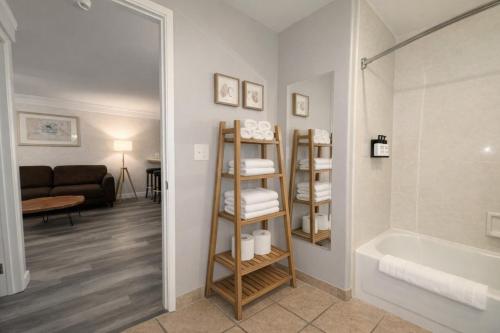 a bathroom with a shower and a bath tub next to a room at Friday Harbor Suites in Friday Harbor