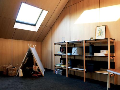 a room with a tent in the corner of a room at Modern design house with sauna 'Arduenna Silva' in La-Roche-en-Ardenne