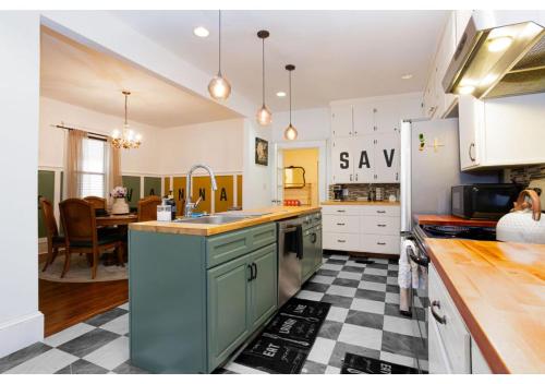 a kitchen with a sink and a counter top at Spacious Home Near Starland, River St & DT - Arcade in Savannah