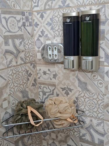 a counter top with two coffee makers on it at La Petite Maison d'Emilie in Lauria Inferiore