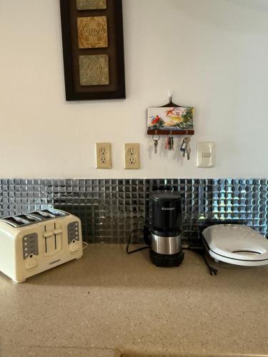 a kitchen with a toaster and a slow cooker at Driftwood 85 in Canaan