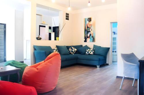 a living room with a couch and a table at The High Hostel in Budva