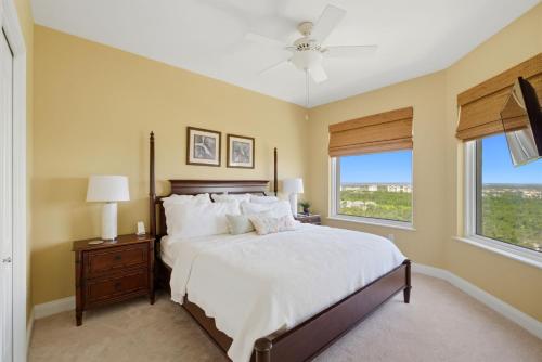 a bedroom with a large bed and a window at PRIVATE BEACH FRONT LUXURY CONDO, AMAZING VIEWS, INDiGO E, 5-STAR, 2 BALCONIES , PREFERRED PARTNER PRG in Pensacola