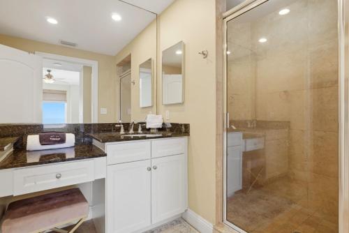 a bathroom with a shower and a sink at PRIVATE BEACH FRONT LUXURY CONDO, AMAZING VIEWS, INDiGO E, 5-STAR, 2 BALCONIES , PREFERRED PARTNER PRG in Pensacola