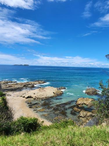 a view of the ocean from a rocky beach at Saltwater Daze - Hosted in Sunshine Bay
