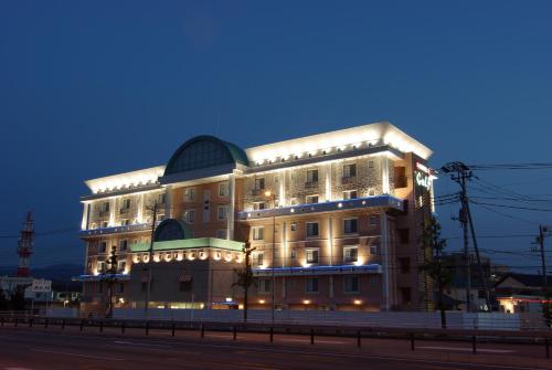 a large building is lit up at night at GOLF Kofu Showa(Adult Only) in Kofu