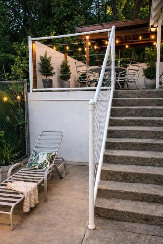a set of stairs with two chairs and a table at Dunsmuir Getaway in Dunsmuir