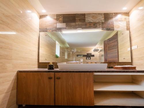 a bathroom with a sink and a mirror at DanCenter Vana Villa I 5BHK I Pvt Pool I Baga I GOA in Goa