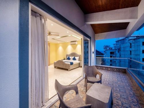 a balcony with a bed and a couch at DanCenter Vana Villa I 5BHK I Pvt Pool I Baga I GOA in Goa
